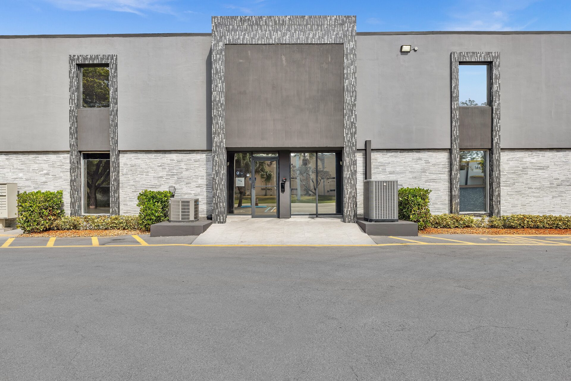 Glass entry doors at Pompano Executive Rentals